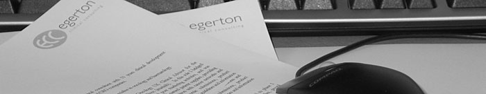 Montage of Egerton Clinical Consulting stationery and desk